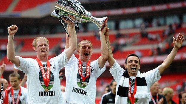 Alan Tate celebrates Swansea's play-off final win in 2011 with Garry Monk and Leon Britton