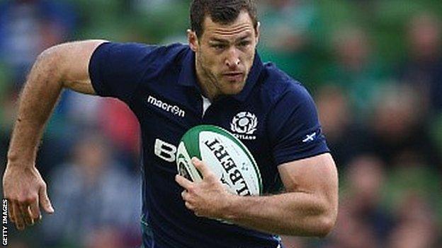 Tim Visser runs with the ball for Scotland against Ireland