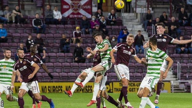 John Souttar (right) heads home Hearts' late winner