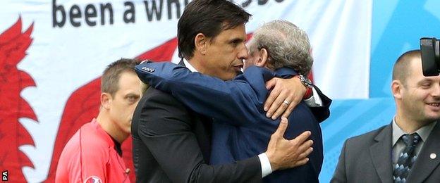 Chris Coleman and Roy Hodgson embrace at full-time in Lens