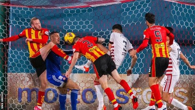 Zak Rudden (left) hooks Thistle into an early lead from close range