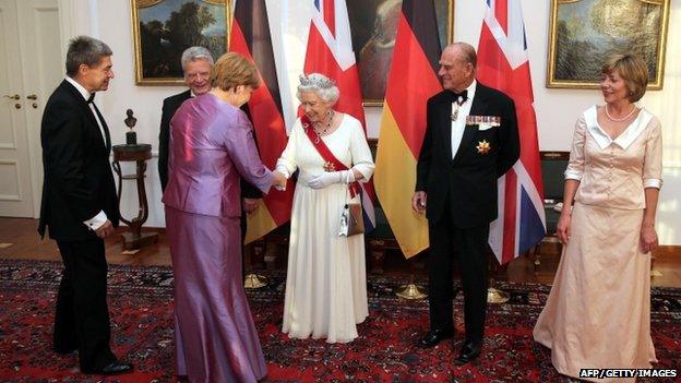 The Queen shakes hands with German Chancellor Angela Merkel