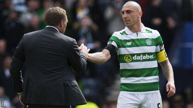 Celtic captain Scott Brown shakes hands with manager Brendan Rodgers