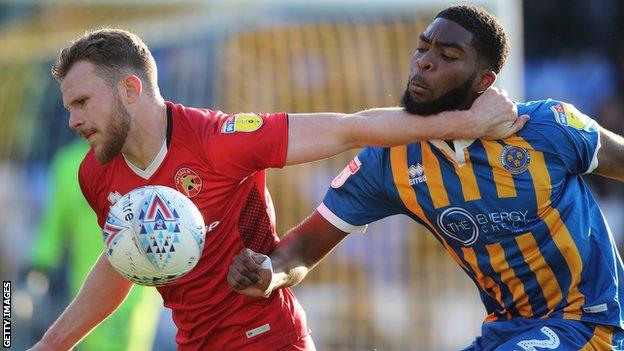 Nicky Devlin of Walsall and Ro-Shaun Williams of Shrewsbury Town