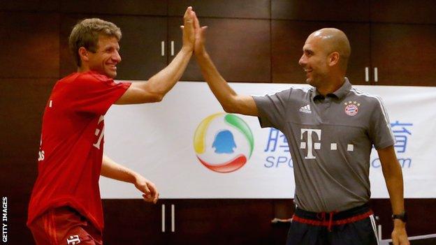 Bayern Munich striker Thomas Muller (left) and manager Pep Guardiola