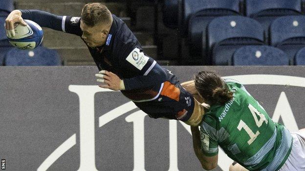 Edinburgh's Darcy Graham is tackled into touch by Tom Arscott of Newcastle Falcons