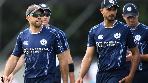 Scotland captain Kyle Coetzer (left) and Safyaan Sharif (second right)