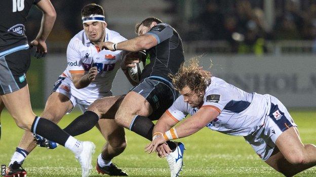 Stuart McInally tackles Fraser Brown