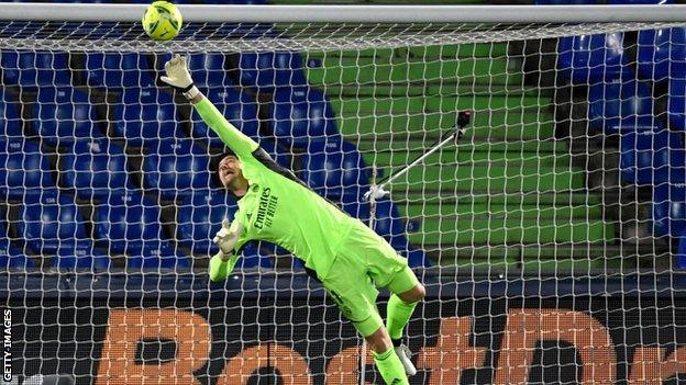 Real Madrid goalkeeper Thibaut Courtois makes a save against Getafe