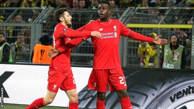 Divock Origi celebrates scoring for Liverpool against Borussia Dortmund, Europa League quarter-final, 2016, with Adam Lallana.