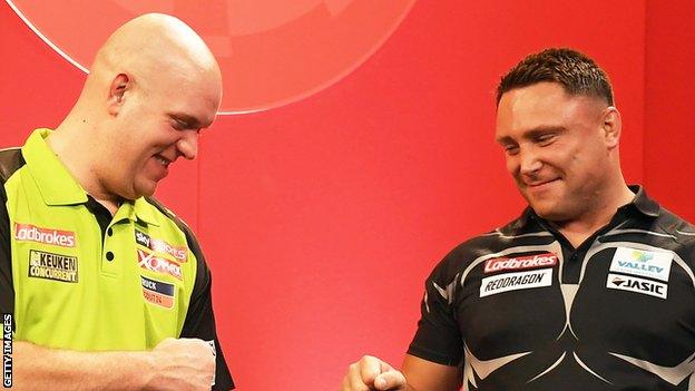 Michael van Gerwen and Gerwyn Price fist-bump ahead of a game