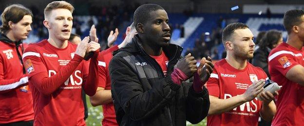 Connah's Quay Nomads players applaud their fans