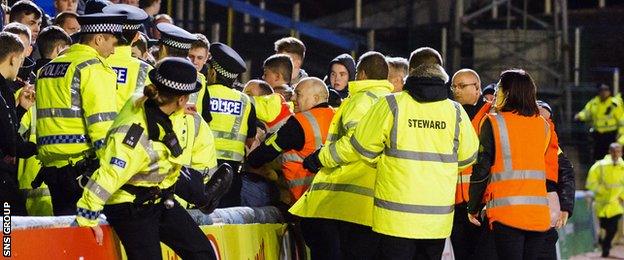 Police and stewards had to step in to deal with trouble in the away end at Cappielow