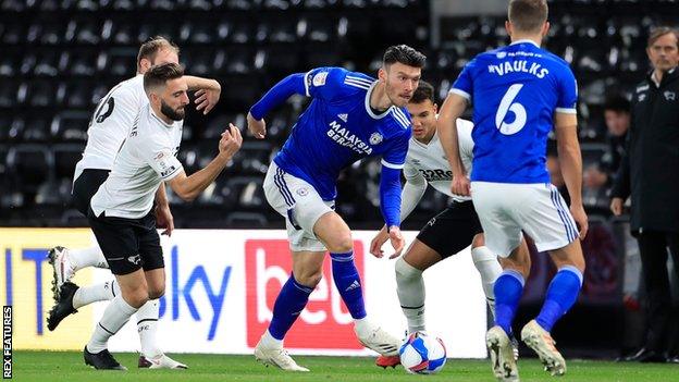 Kieffer Moore carries the ball forward for Cardiff