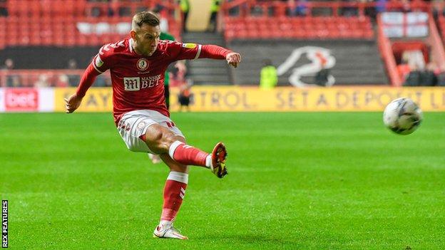 Weimann strikes at goal during Bristol City's match versus Stoke