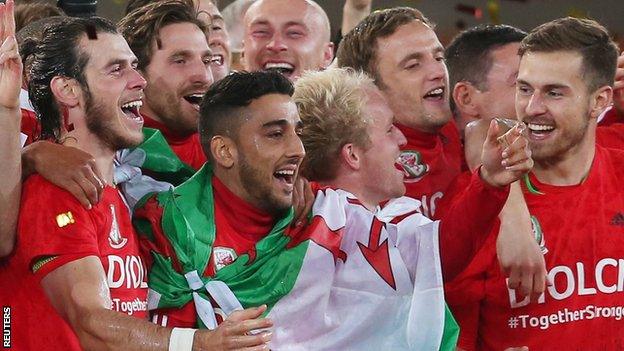 Neil Taylor (third from left) celebrates Euro 2016 qualification along with Wales team-mates, including Gareth Bale (left) and Aaron Ramsey (right)