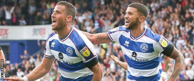 Tomer Hemed (left) and Nakhi Wells celebrate QPR's goal against Wigan