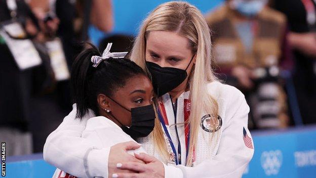 Simone Biles and United States coach Cecile Landi