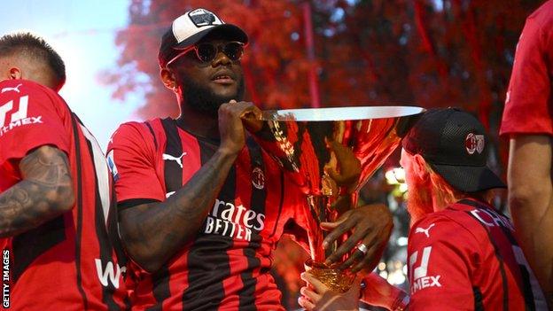 Ivory Coast's Franck Kessie with the Italian Serie A trophy