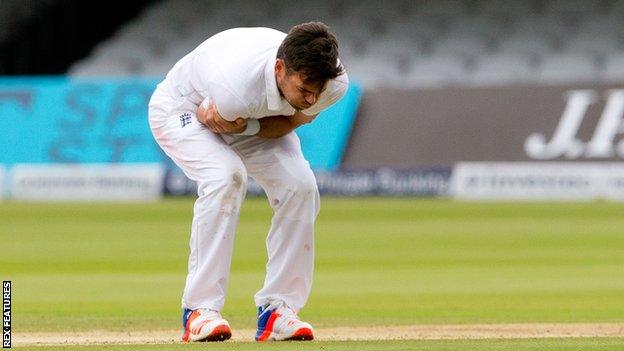 England's James Anderson holds his injured shoulder against Sri Lanka at Lord's