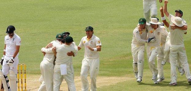 Australia celebrate winning the Ashes test in 2013 as James Anderson trudges off