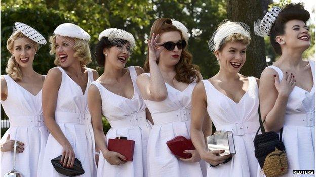 Race goers pose on Ladies Day at Royal Ascot, just south of London, Britain, June 18, 2015