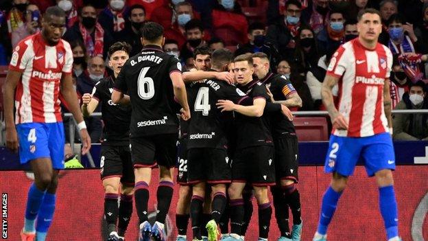 Levante players celebrate scoring against Atletico Madrid