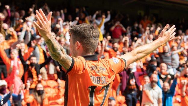 Jamie Robson celebrates scoring for Dundee United against Rangers