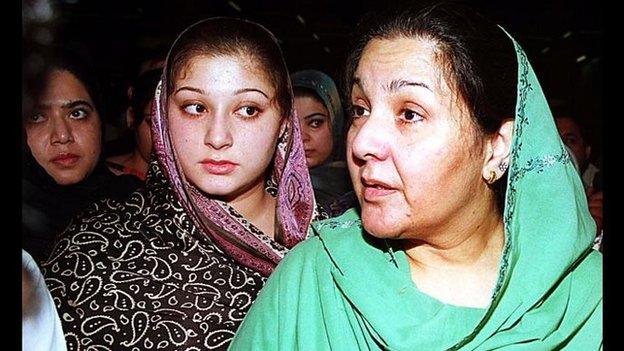 Kulsoom Nawaz, right, wife of deposed prime minister Nawaz Sharif and her two daughters Asma Nawaz, centre, and Maryam Sharif, left, listen to reporters' questions after arriving at Karachi airport on 25 November 1999