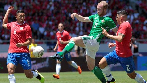 Northern Ireland striker Liam Boyce threatens in the opening minutes before going off injured