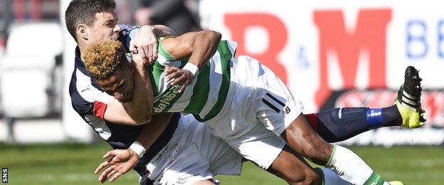 Dundee's Darren O'Dea wrestles Celtic winger Scott Sinclair to the ground