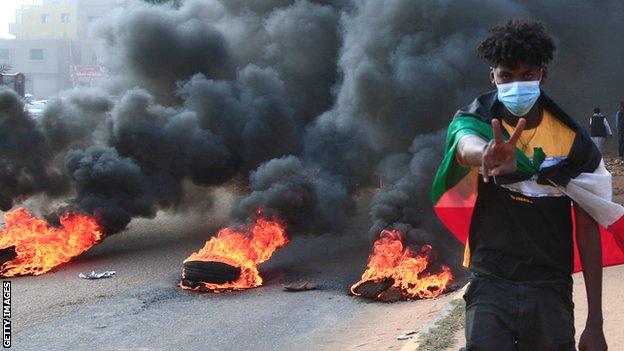 A protestor in Khartoum after a military coup