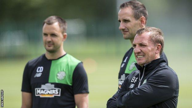 John Kennedy (central) with Brendan Rodgers and Chris Davies (left)