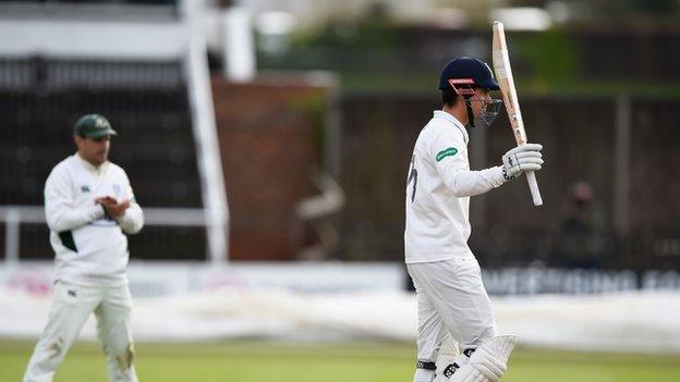 Alastair Cook acknowledges his 17th first-class century for Essex - and the 54th of his career