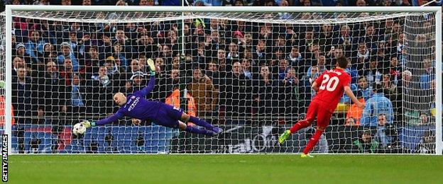 Manchester City goalkeeper Willy Caballero keeps out Adam Lallana's penalty