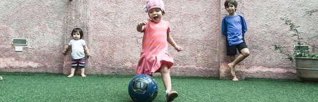 Joao and his sisters enjoy football