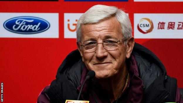 Marcello Lippi smiles at a China press conference