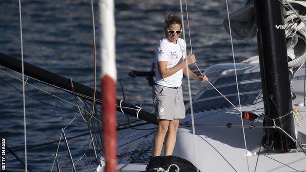 Sam Davies on her boat arriving into Cape Town