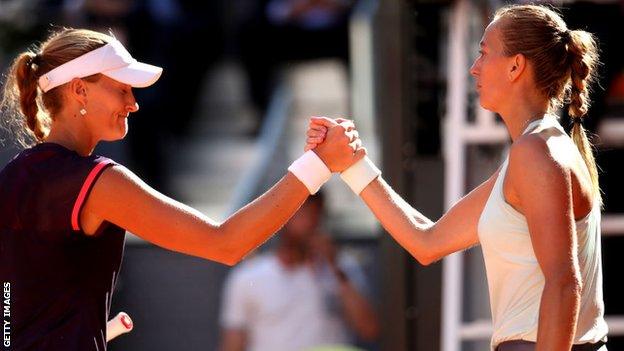 Petra Kvitova and Kristina Mladenovic shake hands in Madrid