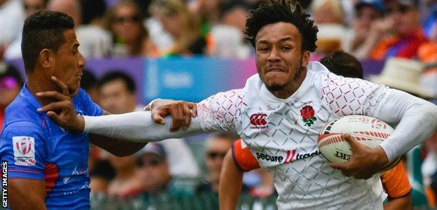 Ryan Olowofela hands off an opponent from Samoa at the World Sevens Series event in Hong Kong