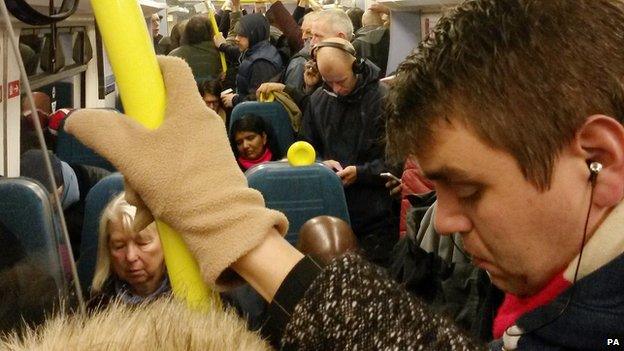 Passengers on busy train