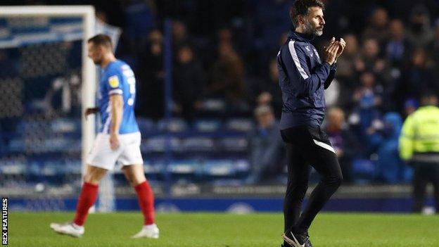 Portsmouth manager Danny Cowley walks off after his side's 4-0 home defeat by Ipswich