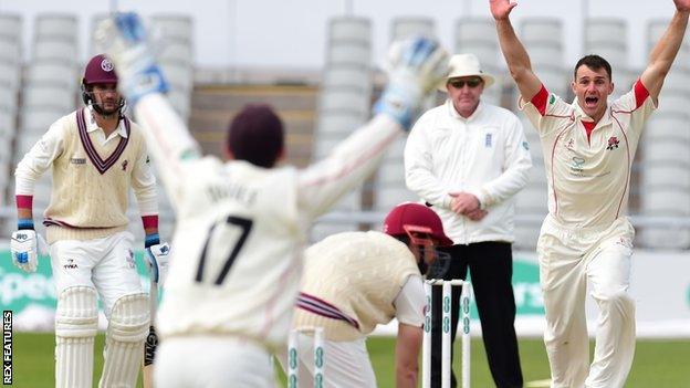 Ryan McLaren celebrates the dismissal of Somerset's James Hildreth at Old Trafford