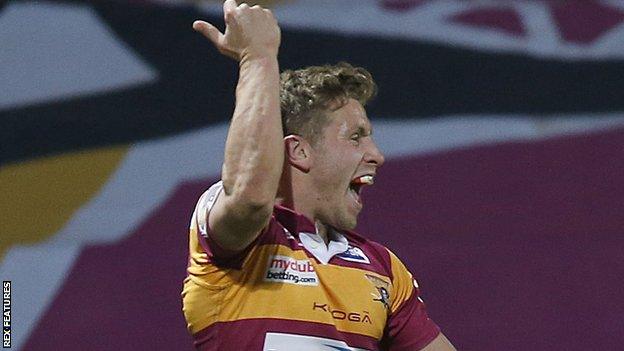 Huddersfield's Kyle Wood celebrates his try against Leeds