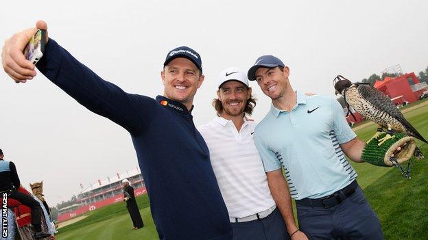 Justin Rose, Tommy Fleetwood and Rory Mcilroy pose for a photo