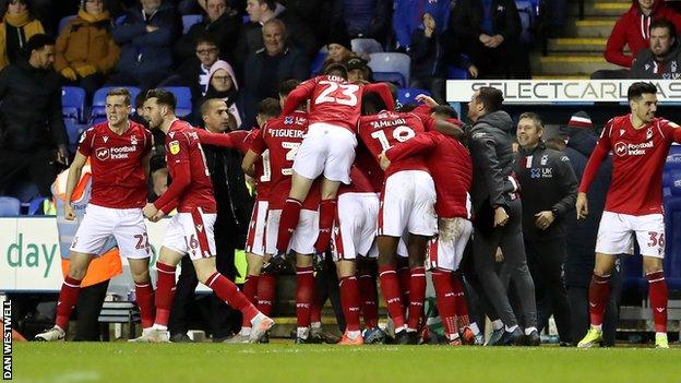 Forest players celebrate Ben Watson's 966th-minute strike
