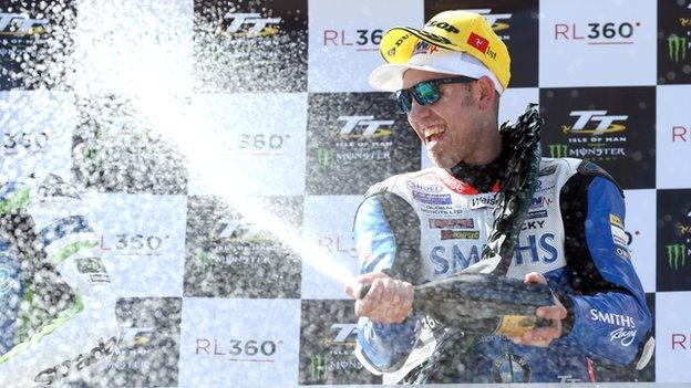 It's champagne time for Peter Hickman as he celebrates his Superstock success