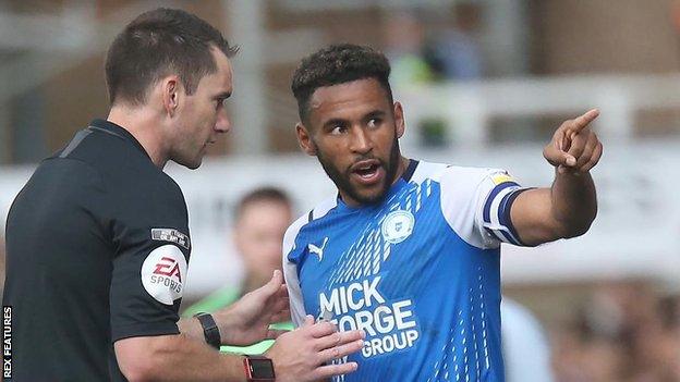 Nathan Thompson spoke to referee Jarred Gillett following the incident in the second half of Peterborough's win over Birmingham on Saturday