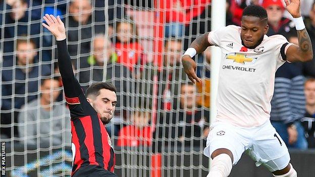 Manchester United player Fred (right) and Bournemouth's Lewis Cook