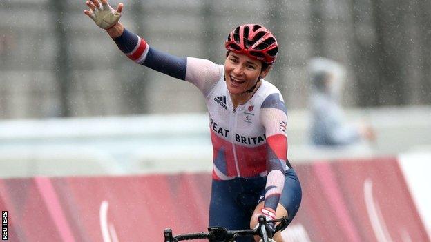 Sarah Storey celebrates crossing the line